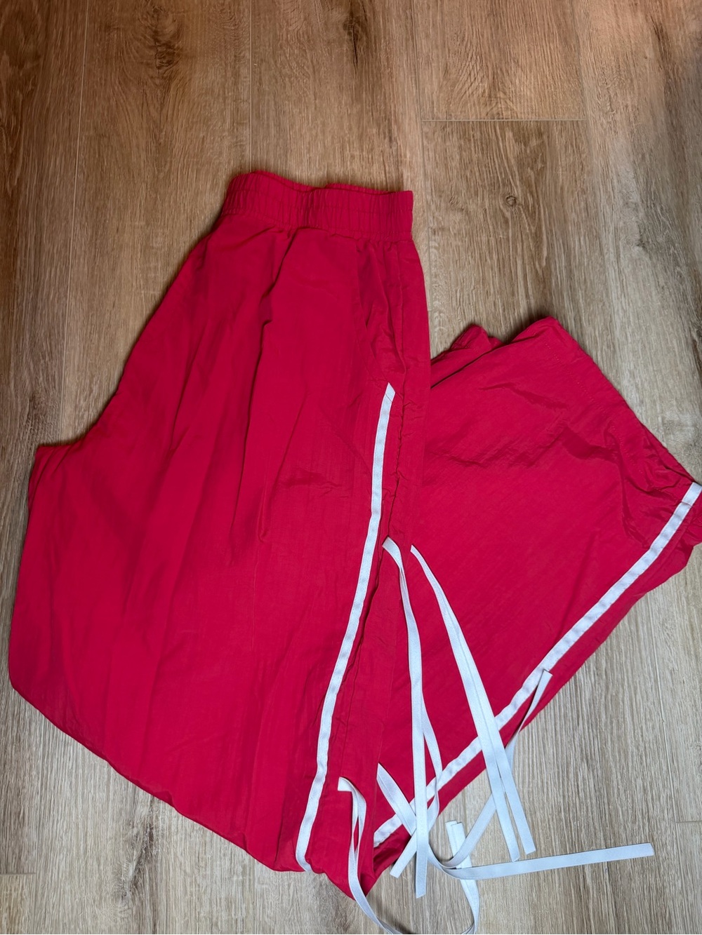 Red windbreaker pants